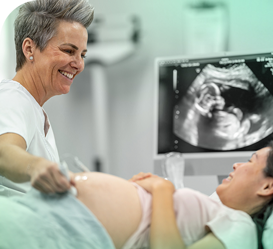 image of a sonographer giving a pregnant woman a ultrasound